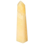 Mexican Calcite Obelisk from Sylvia Crystals, enhancing positivity and self-confidence, shown in elegant light stone form.