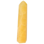 Elegant Mexican Calcite Obelisk by Sylvia Crystals, showcasing premium quality and spiritual significance.
