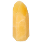 Mexican Calcite Obelisk from Sylvia Crystals, enhances self-confidence and vitality, premium handpicked mineral sculpture.