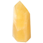 Mexican Calcite Obelisk by Sylvia Crystals, a yellow gemstone crafted for energy transformation and motivation.