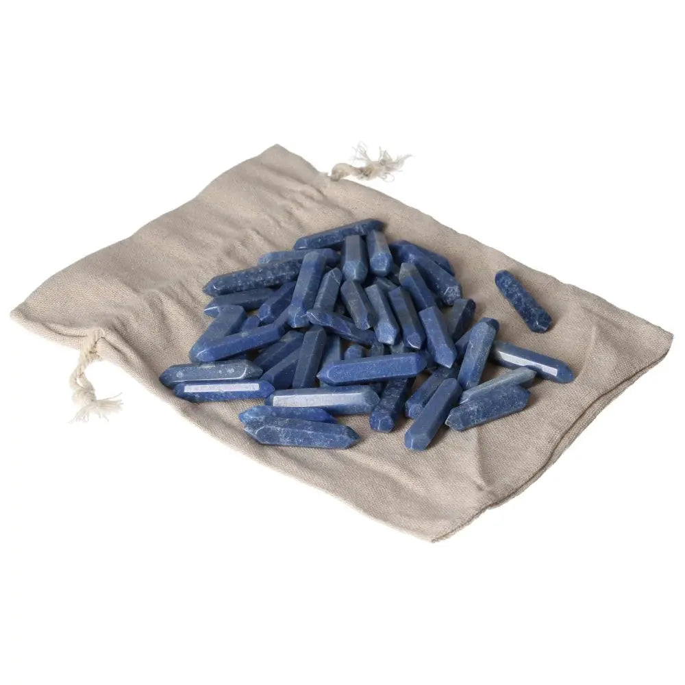 Blue Aventurine small sticks on a beige cloth, ideal for spiritual transformation and attunement on your personal journey.