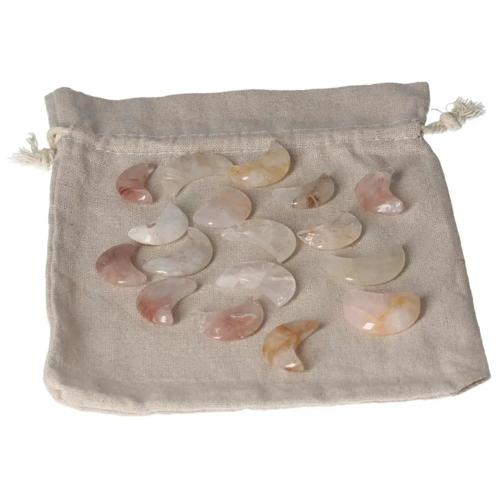 Golden Healer small moon crystals on a beige pouch, perfect for healing and spiritual wellness. Energetic and elegant décor.