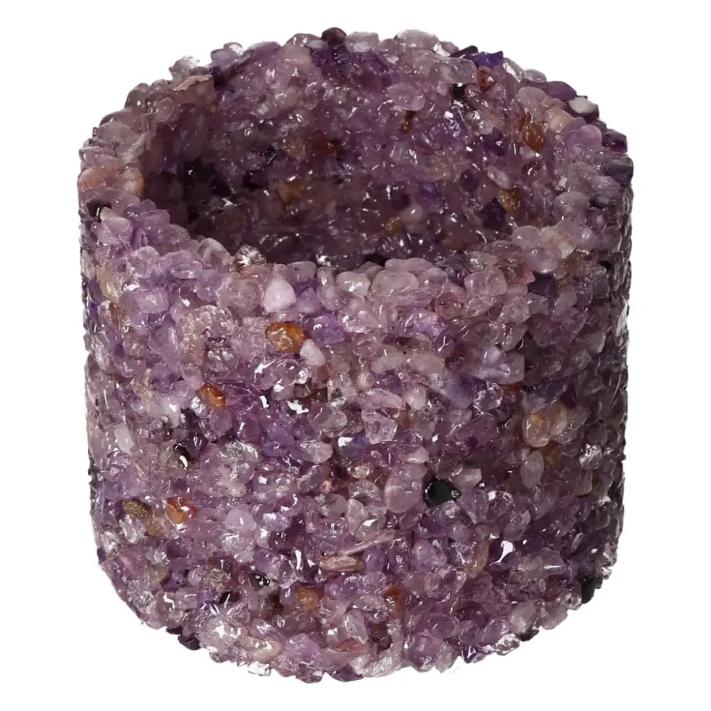 Candle holder made of natural amethyst crystals, enhancing tranquility and sophistication in decor by Sylvia Crystals.