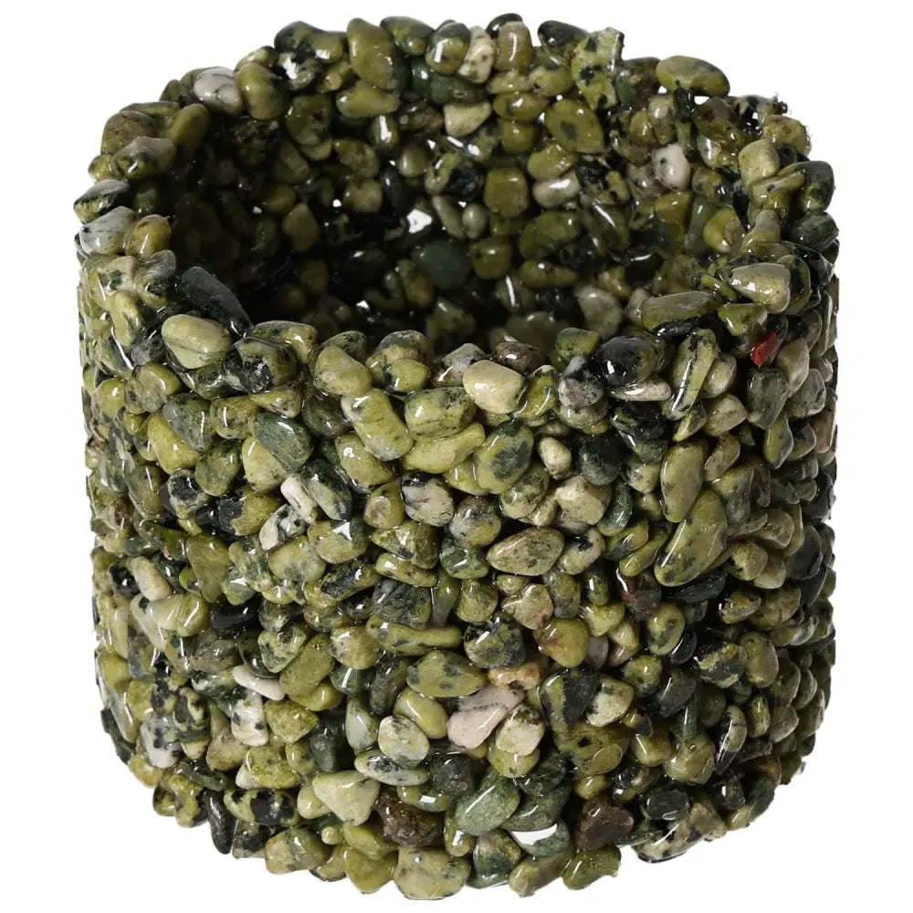 Jadeite candle holder by Sylvia Crystals, a luxurious pot cover with rich green stones symbolizing power and harmony.