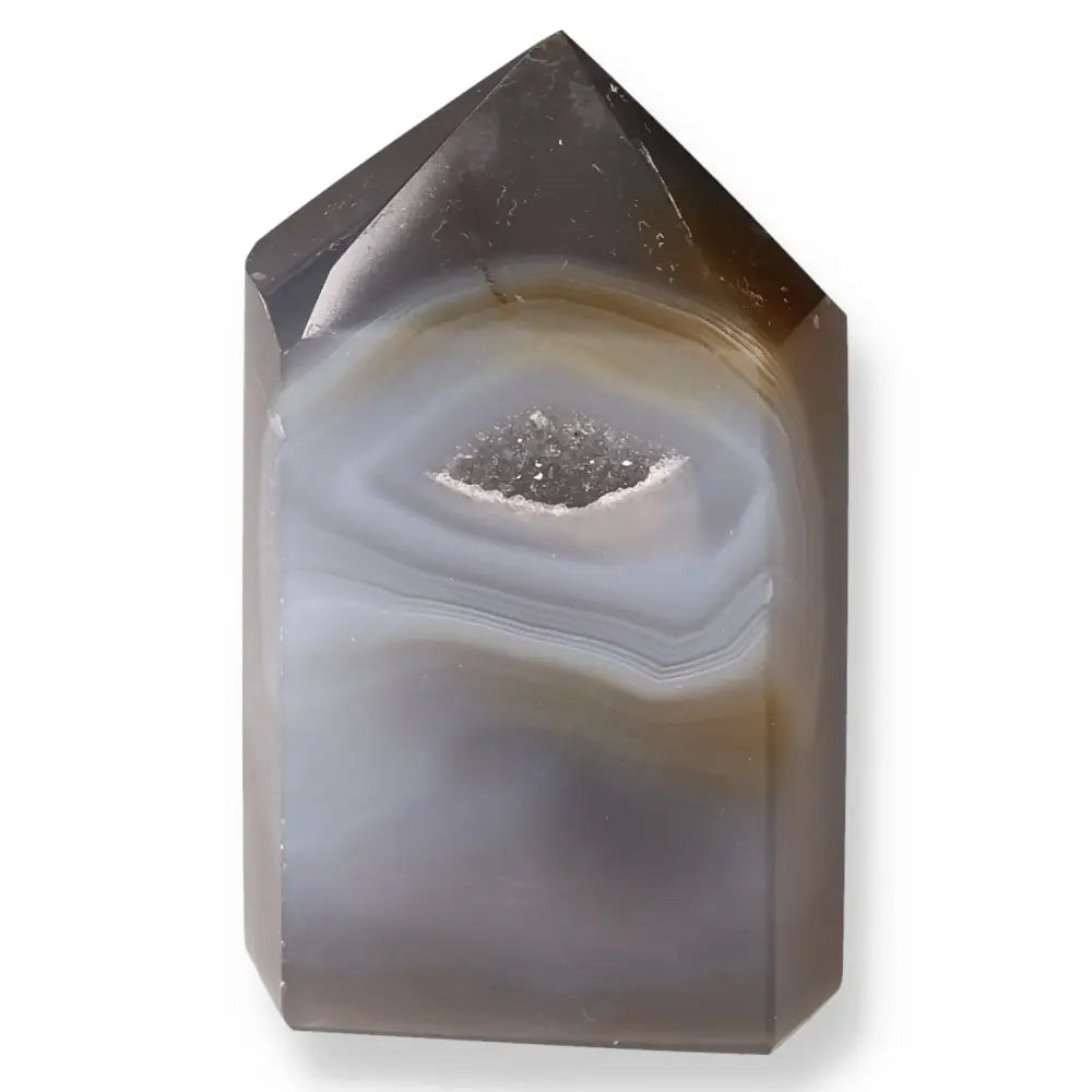 Polished agate geode point showcasing natural formations and earthy hues for balance and harmony.