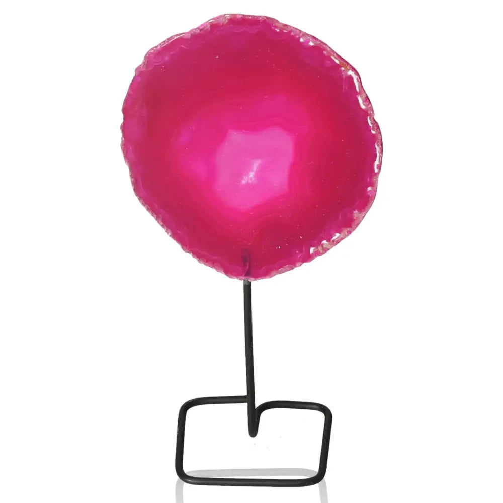 Pink agate slice on metal stand, showcasing vibrant hues and intricate patterns, ideal for enhancing decor and adding tranquility to any space.