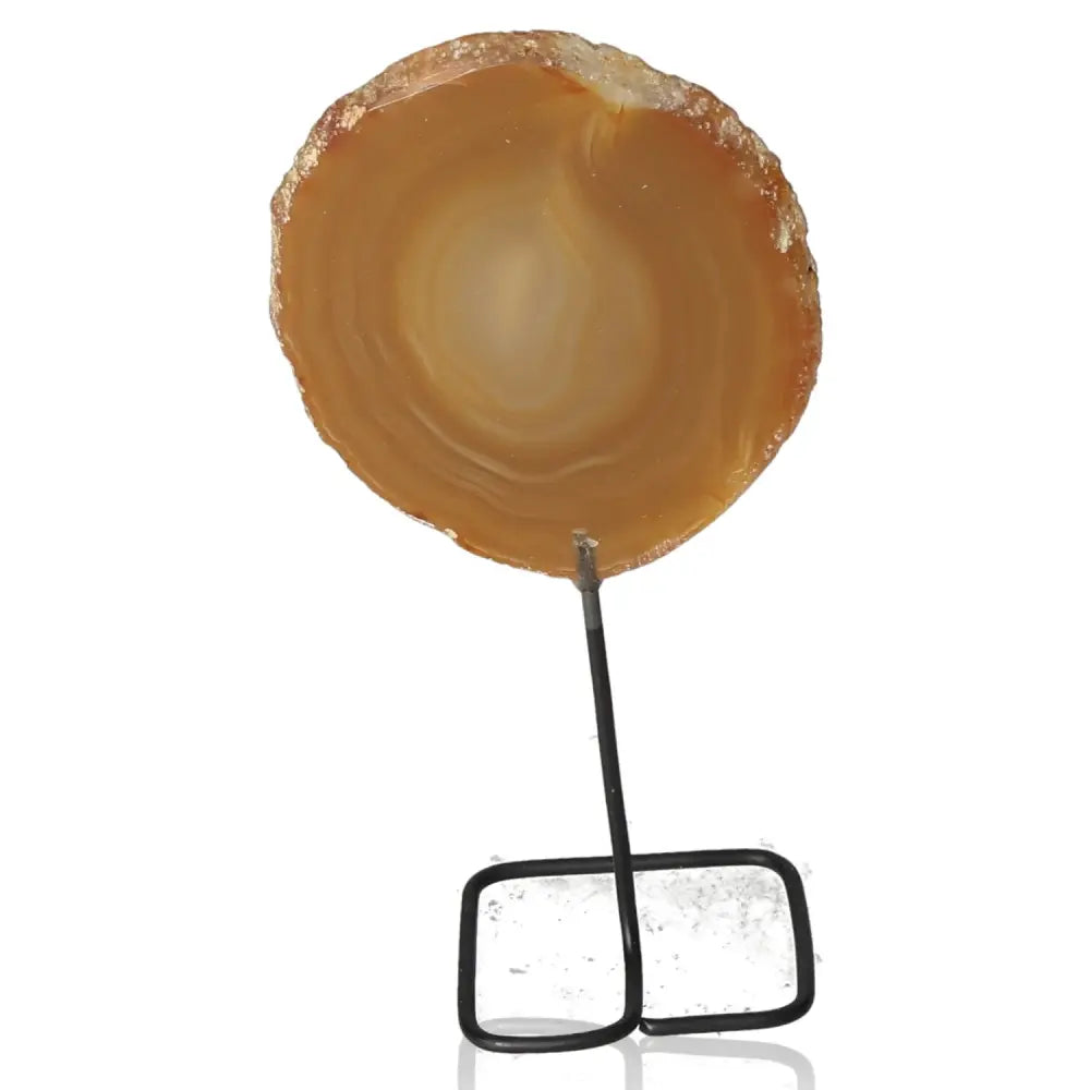 Agate slice on metal stand ideal for home or office decor, offering calming energy and emotional balance.