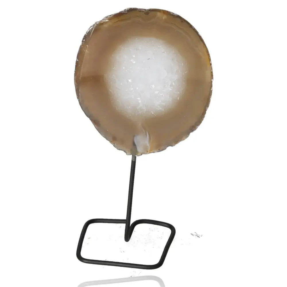 Agate slice on metal stand, showcasing natural beauty and tranquil energy ideal for home and office decor.