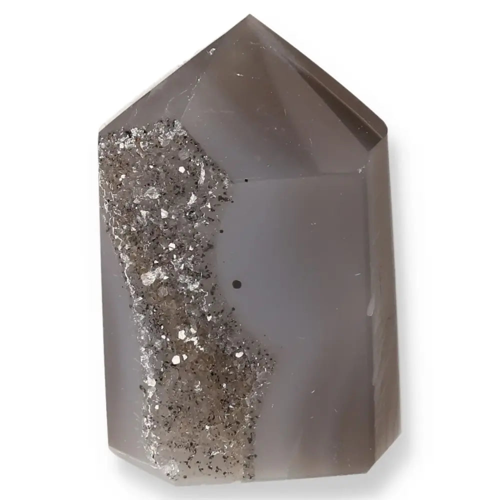 Polished agate geoded point crystal with natural sparkling formations.
