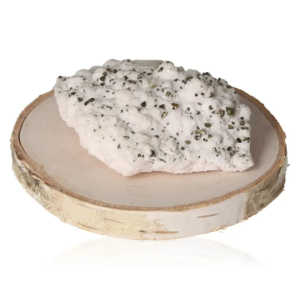 Manganocalcite with Chalcopyrite gemstone on wooden slice, showcasing its exquisite beauty and energy, available at Sylvia Crystals.