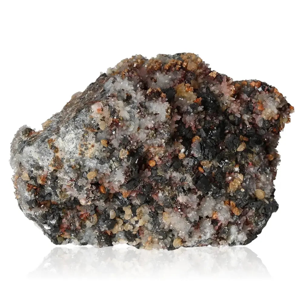 Creedite mineral with vibrant orange and purple hues, symbolizing high vibrational energy and transformation, on a reflective surface