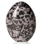 Indigo Gabbro free form stone with black and indigo swirling patterns, known for enhancing intuition and spiritual growth.
