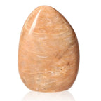 Peach Moonstone Free Form, a calming stone with soft peach hues, promotes emotional healing and inner peace, linked to feminine energy and intuition.