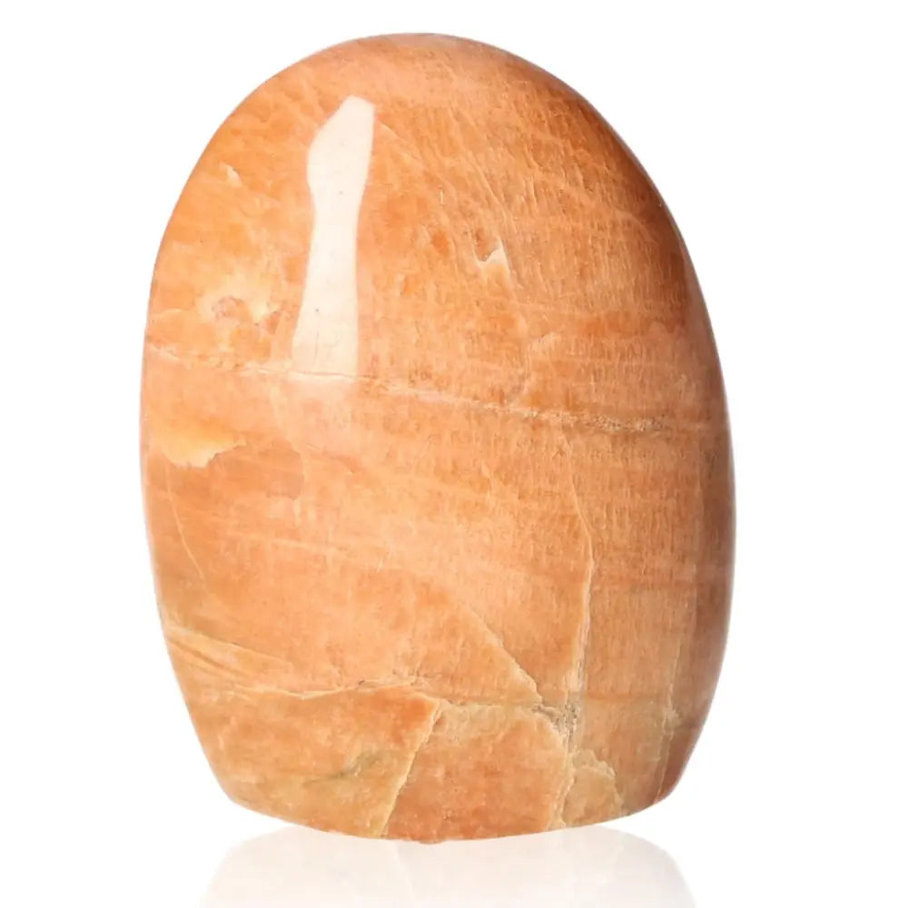 Peach Moonstone Free Form Stone, nurturing with soft peach hue, promotes inner peace and emotional healing, ideal for new beginnings.