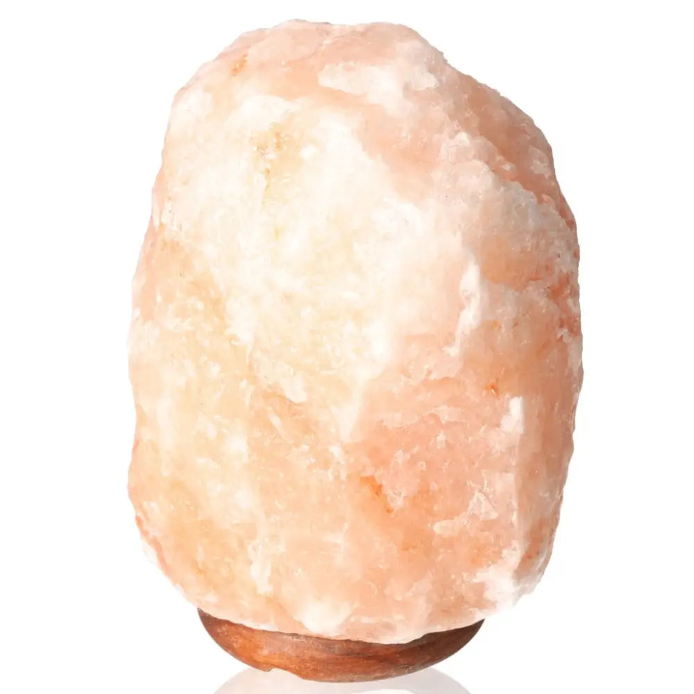 Himalayan Salt Lamp 4Kg emitting warm amber light, hand-carved from authentic pink salt crystals for home décor and wellness benefits.