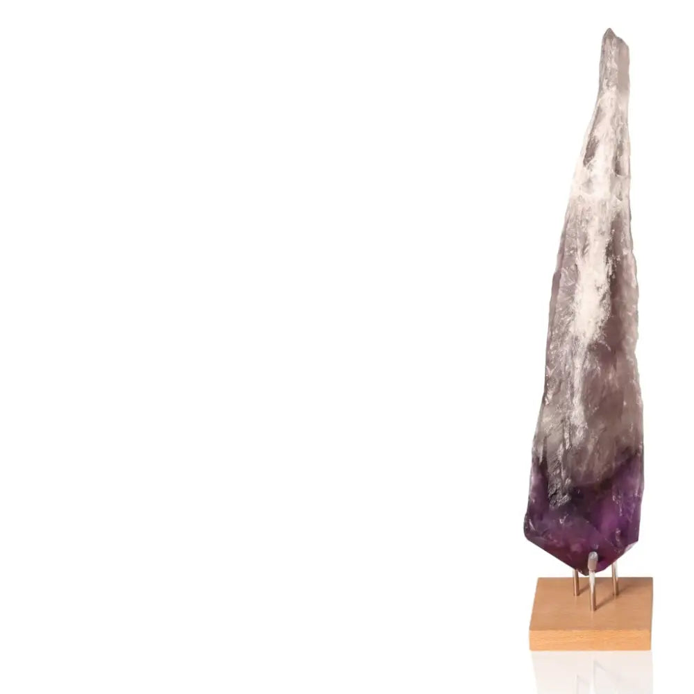 Natural Amethyst Point gemstone on display stand, showcasing its genuine crystal formation for mental clarity and emotional balance.