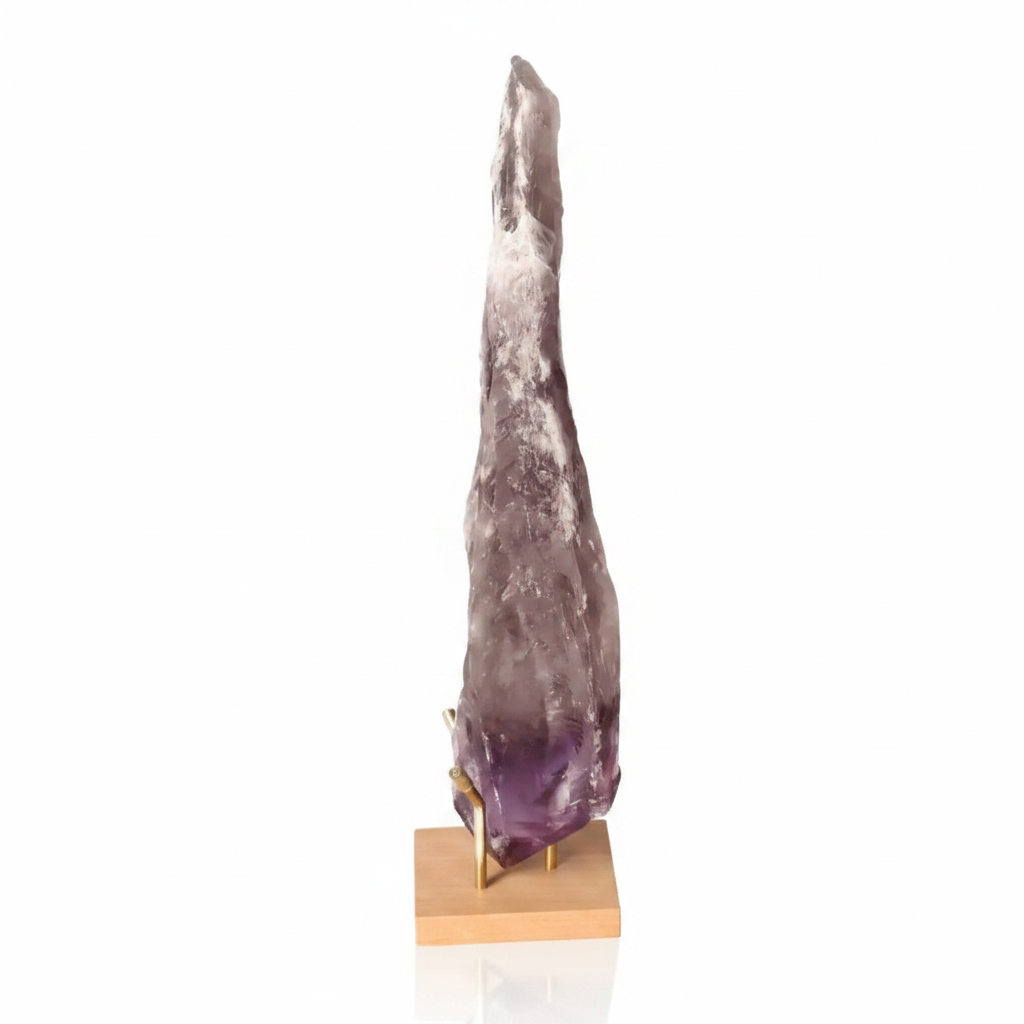 Natural Amethyst Point gemstone with rich purple hues, standing elegantly on a wooden base, ideal for enhancing spiritual growth and tranquility.