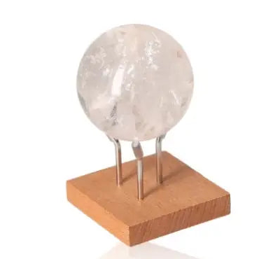 Lemurian Quartz Sphere on wooden display stand, showcasing its elegant design and mystical energy from Sylvia Crystals.