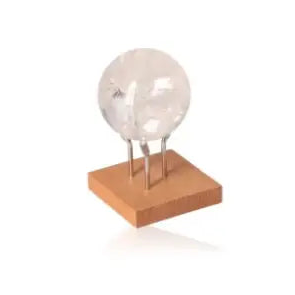 Lemurian Quartz Sphere from Sylvia Crystals on a wooden stand, showcasing crystalline clarity and elegance for spiritual enrichment.