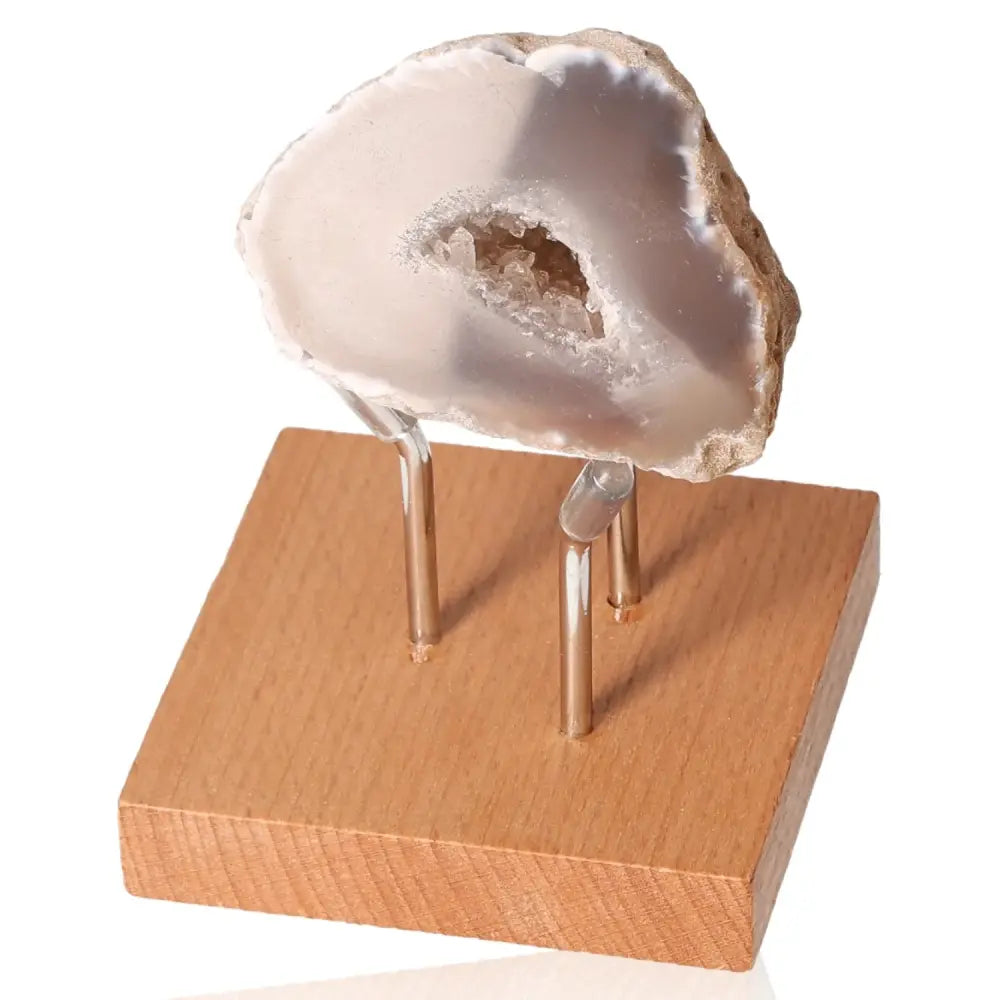 Mini Agate Geode gemstone on stand, showcasing vibrant layers and natural beauty for energy balance and calmness.