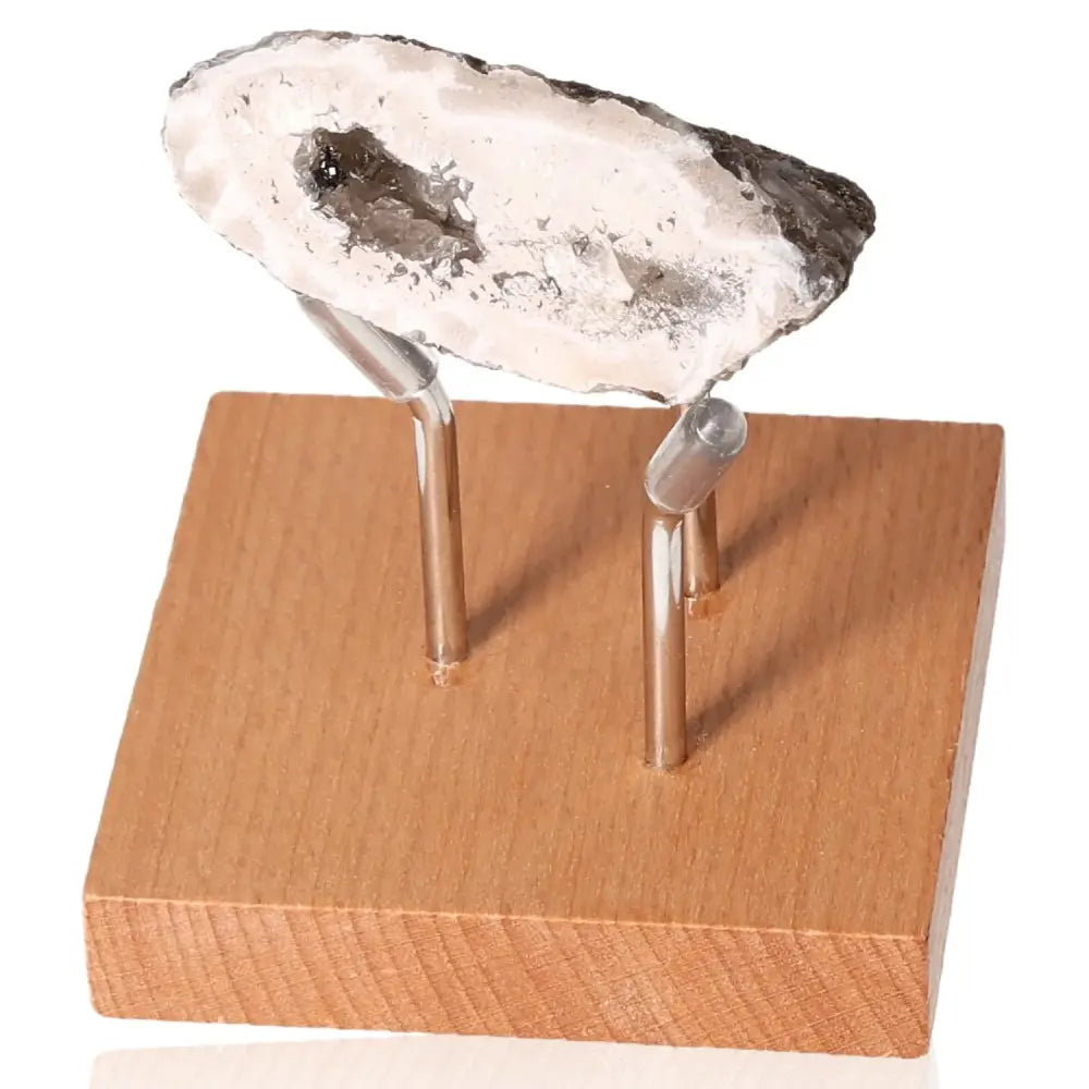 Mini Agate Geode on a wooden stand, showcasing natural textures and colors, perfect for energy balance and home decor.