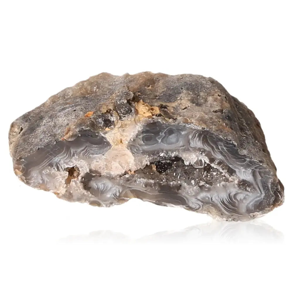 Mini Agate Geode displaying natural patterns and calming colors, known for its tranquil and balancing properties in harmonious spaces.