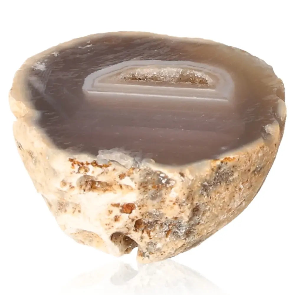 Mini Agate Geode showcasing intricate patterns and vibrant colors, known for harmonizing energies and providing tranquility and security.