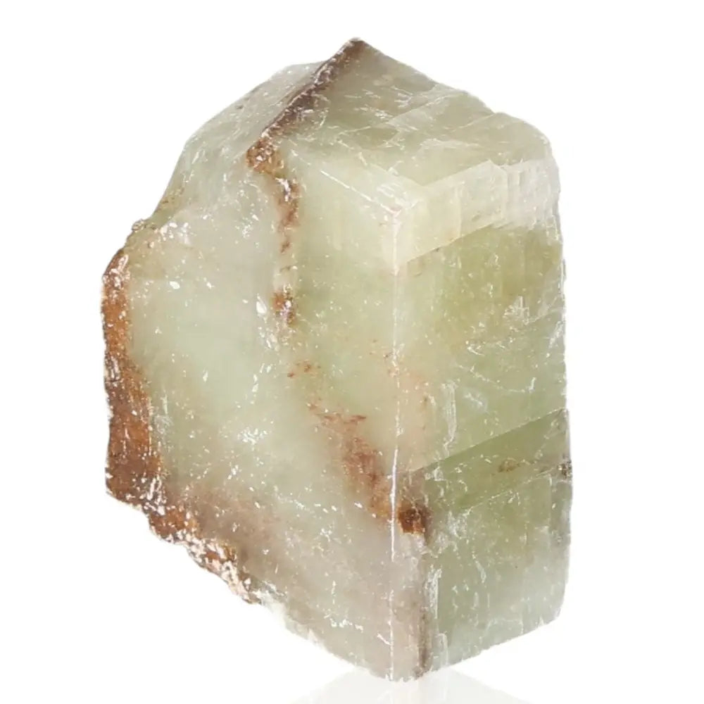 Close-up of vibrant green calcite crystal, symbolizing renewal and emotional healing, ideal for heart chakra and positive energy attraction.