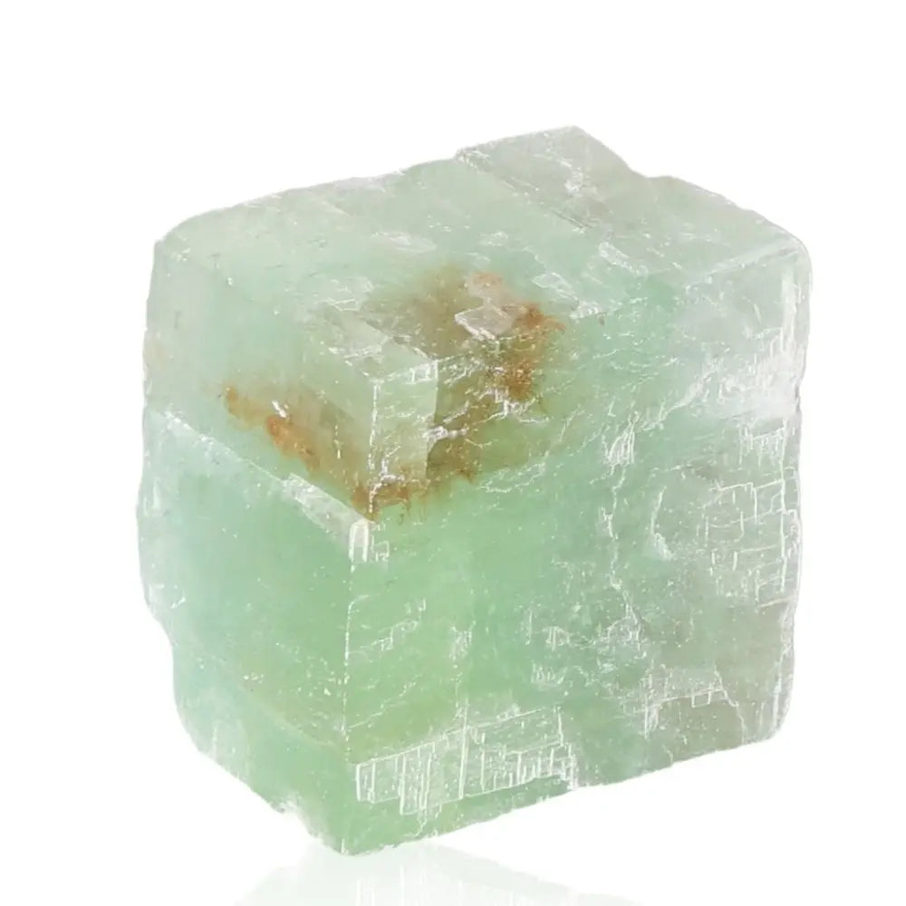 Green Calcite crystal known for renewal, emotional healing, and heart energy, showcasing its vibrant green hue and soothing properties.