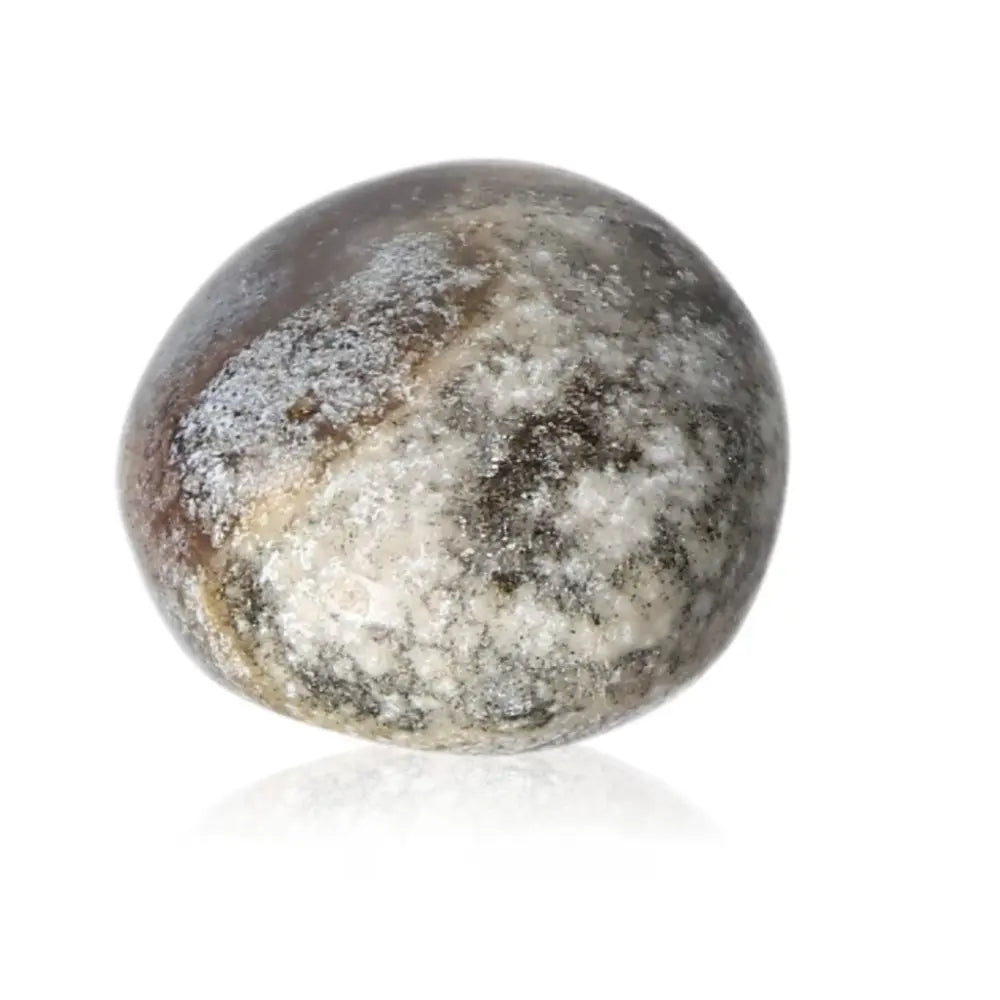 Tumbled Jasper stone showcasing earthy tones, representing tranquility and balance, ideal for stress relief and energy alignment.