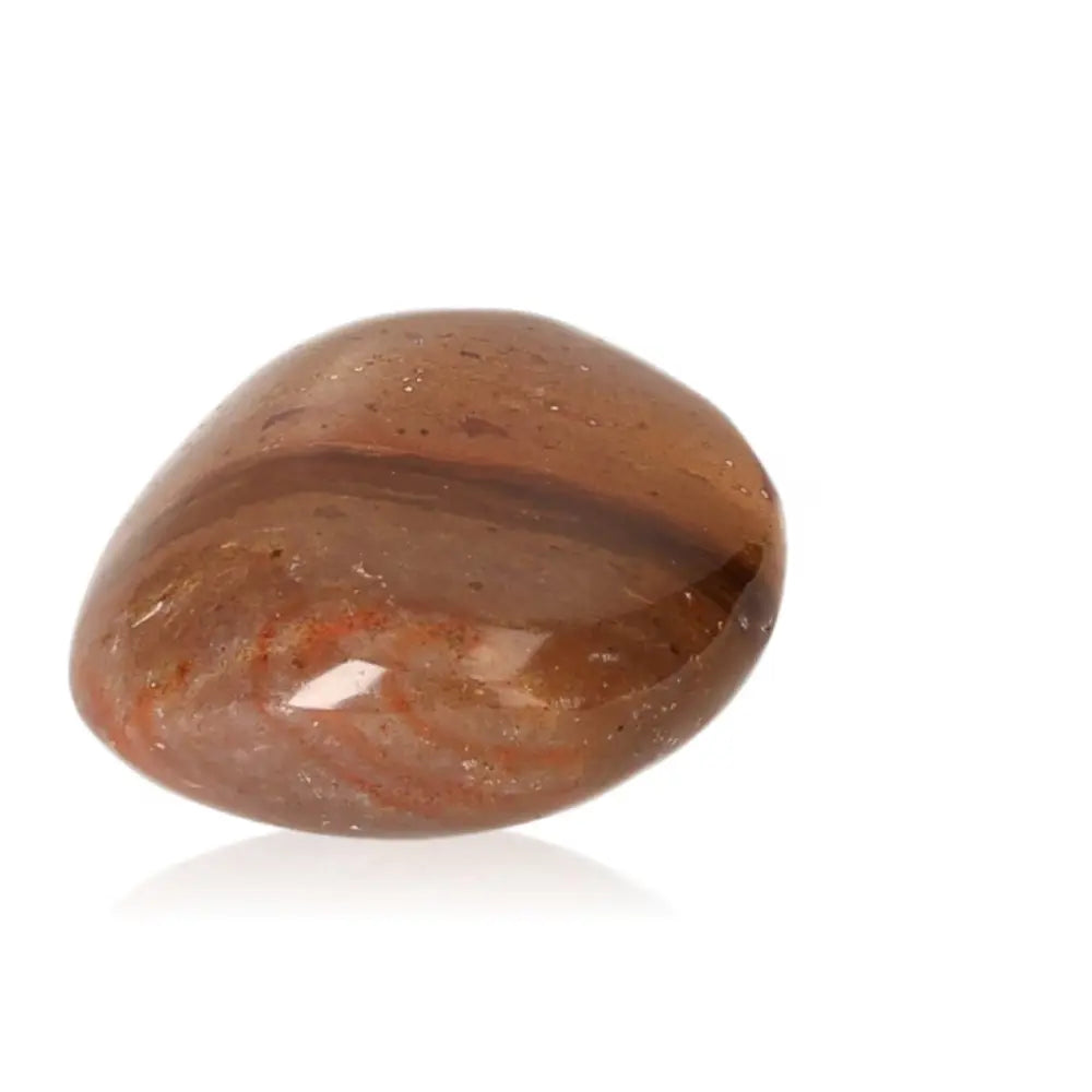 Tumbled Jasper gemstone radiating warmth and positivity, known for balancing energy and supporting joyful pursuits.