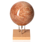 Peach Moonstone Sphere on stand, promotes emotional balance and intuition, ideal for enhancing attractiveness and ensuring restful sleep.