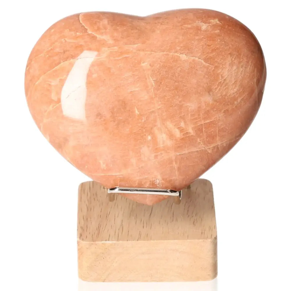 Heart-shaped peach moonstone promoting emotional balance and intuition, ideal for enhancing sensitivity and ensuring restful sleep.