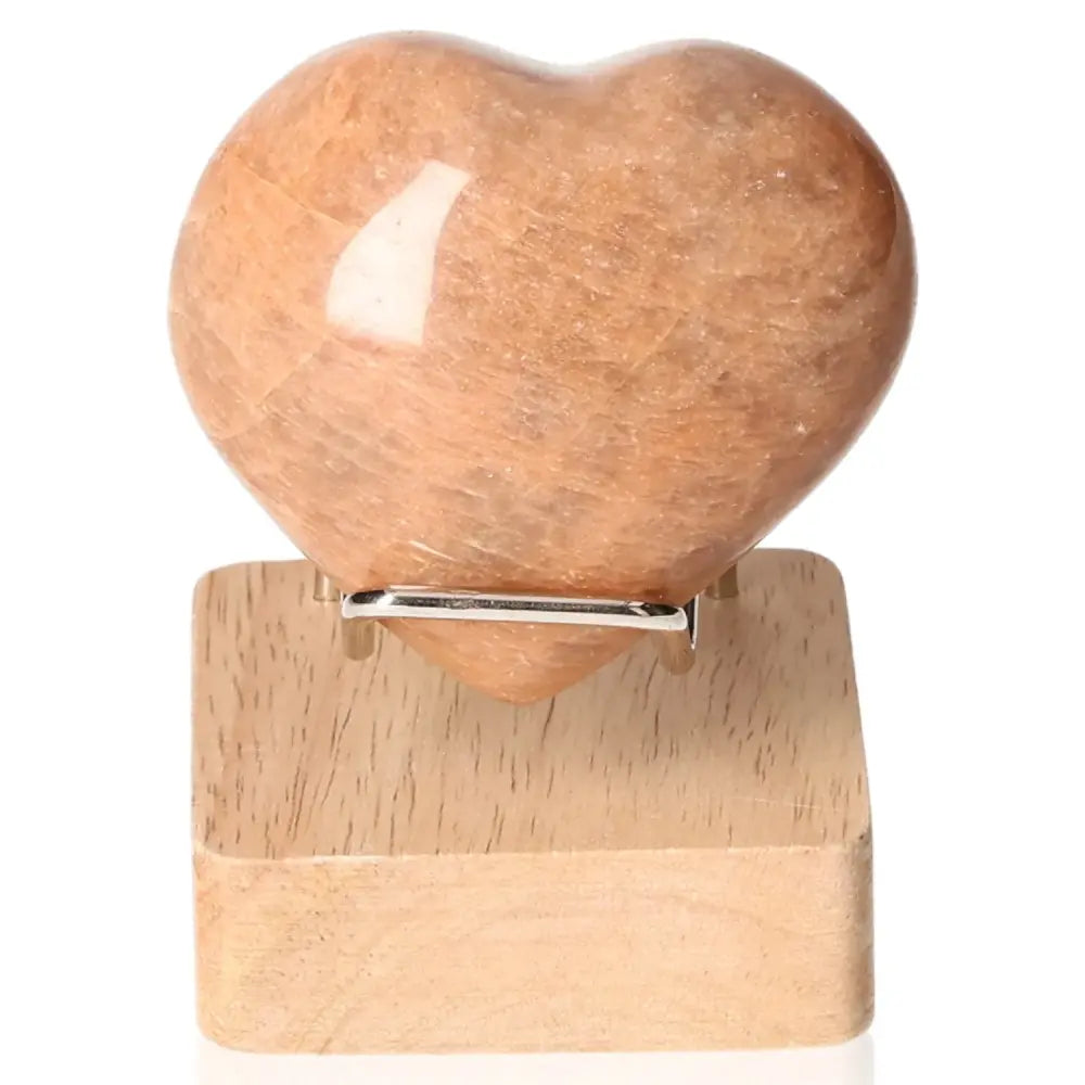 Peach Moonstone Heart gemstone on stand for emotional balance and intuition