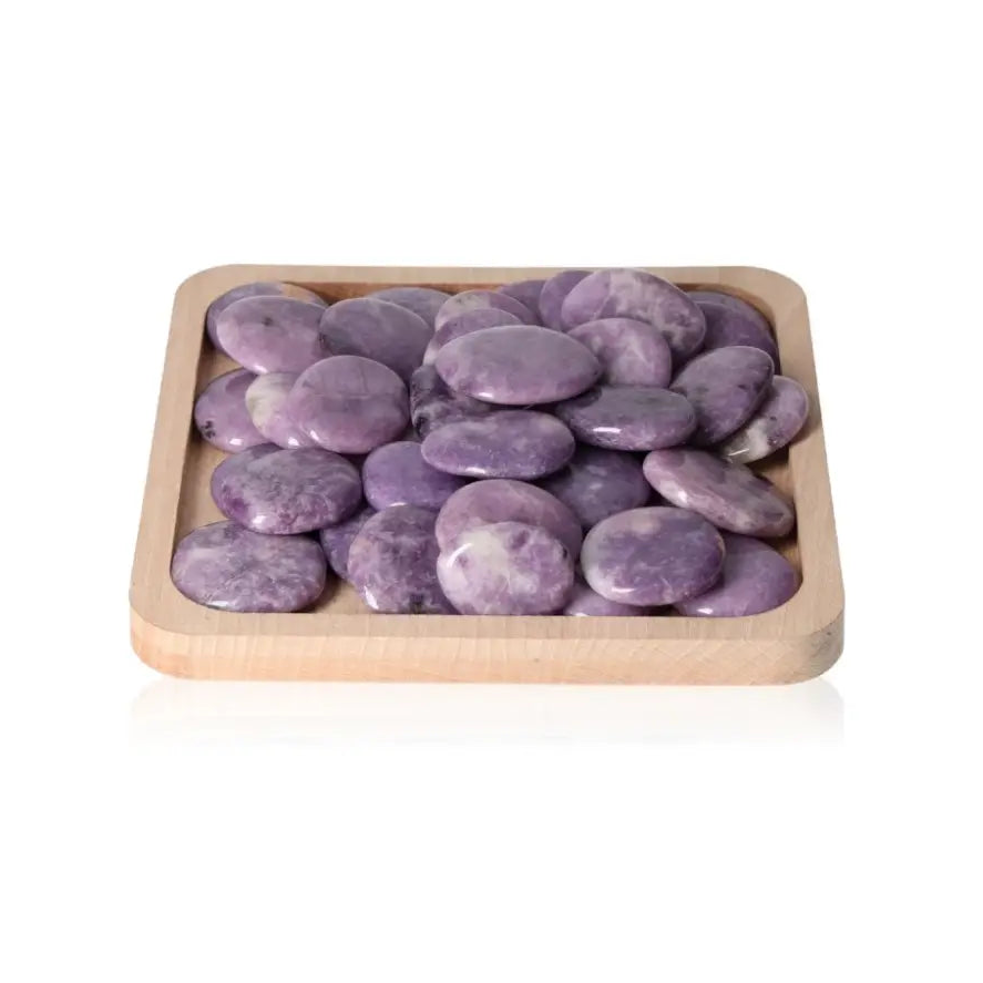 Lepidolite palm stones in a wooden tray, offering peace, emotional balance, and soothing energy for anxiety relief and positive outlook.