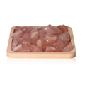 Pink Chalcedony crystals from Sylvia Crystals, promoting emotional balance and positive thinking, displayed on a wooden tray.