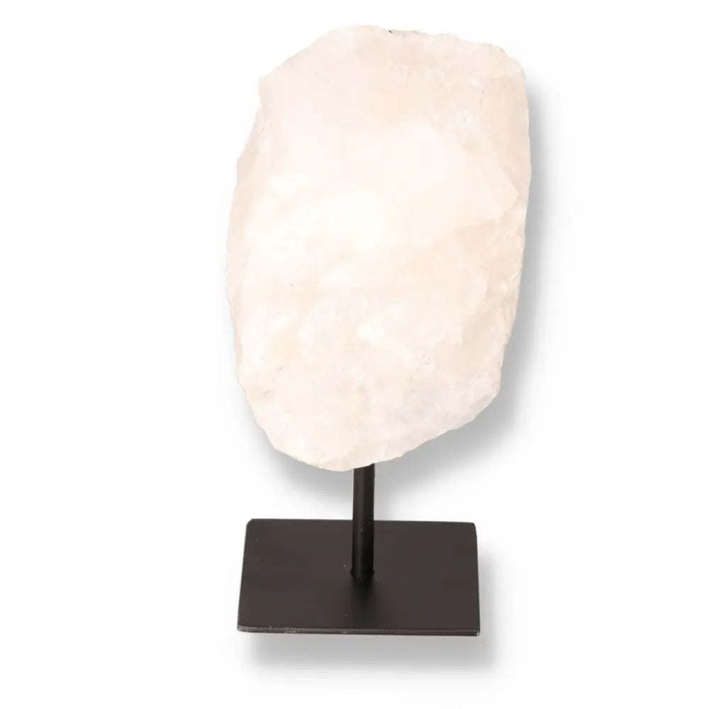 Cut Milky Quartz on metal stand, Sylvia Crystals, showcasing its opaque, cloudy appearance, known for purifying and amplifying properties.
