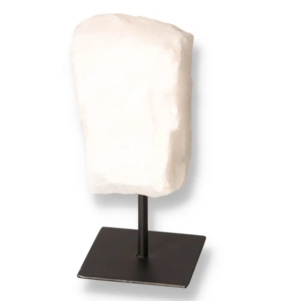 Exquisite Cut Milky Quartz on Metal Stand showcasing a cloudy, opaque appearance from Sylvia Crystals' curated collection.