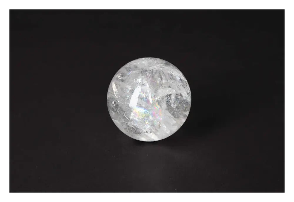 Elegant Lemurian Quartz Sphere by Sylvia Crystals, showcasing premium spiritual design on a dark background.