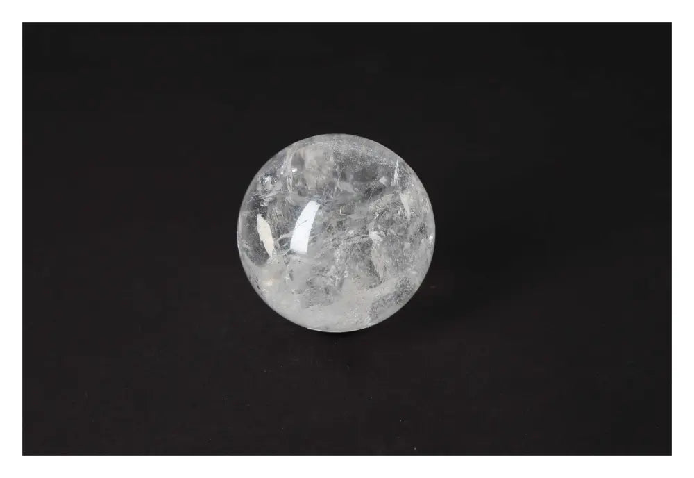 Exquisite Lemurian Quartz Sphere on black background, showcasing Sylvia Crystals' luxury and spiritual harmony.