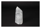 Clear Crystal Quartz Point on black background, offering clarity and spiritual growth; a premium Sylvia Crystals product.