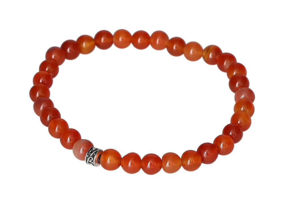 Carnelian 6 mm Bracelet 634342 P10 with vibrant orange beads on elastic band, showcasing natural translucency and elegance.