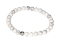Magnesite 6 mm Bracelet 634373 P10 with polished beads showcasing serene white tones and gray veining on an elastic band.