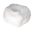 Rock Crystal Rough Candle Holder 634526 P10 made of natural rough quartz with carved candle cavity, showcasing clarity and light reflections.