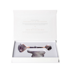Amethyst Roller And Gua Sha Set 634908 in packaging, showcasing a luxurious purple crystal facial tool for calming skin.