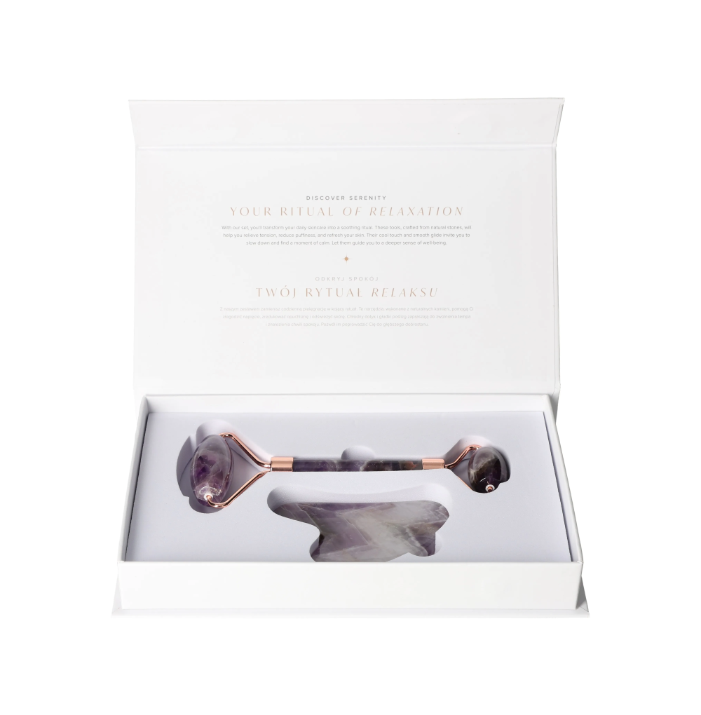 Amethyst Roller And Gua Sha Set 634908 in packaging, showcasing a luxurious purple crystal facial tool for calming skin.
