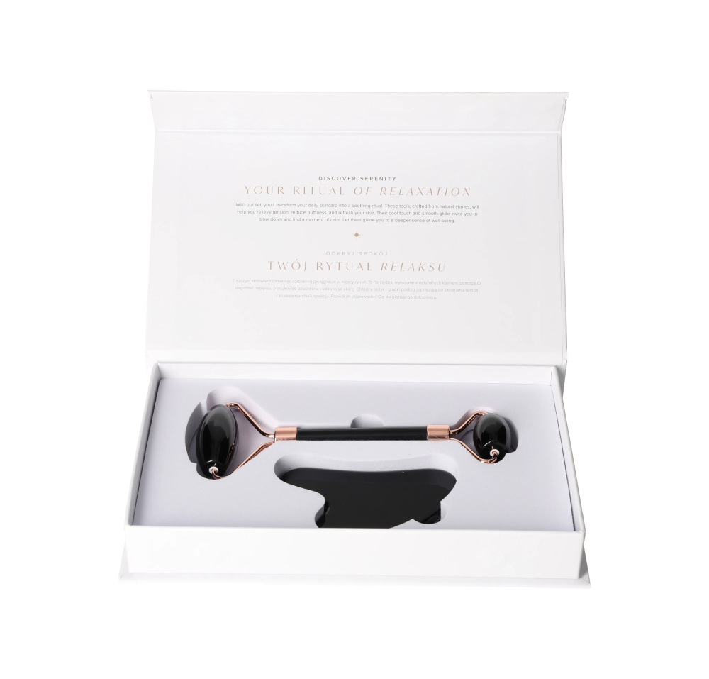 Obsidian Roller And Gua Sha Set 635363 in white box, featuring a black obsidian facial roller and gua sha tool for deep skin renewal.