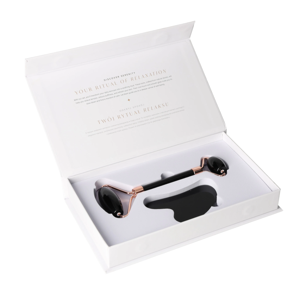 Obsidian Roller And Gua Sha Set 635363 in elegant gift box showcasing volcanic black stone tools for skin renewal and beauty rituals.
