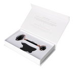 Obsidian Roller And Gua Sha Set 635363 displayed in an elegant white box, featuring a black stone roller and gua sha tool for skin renewal.