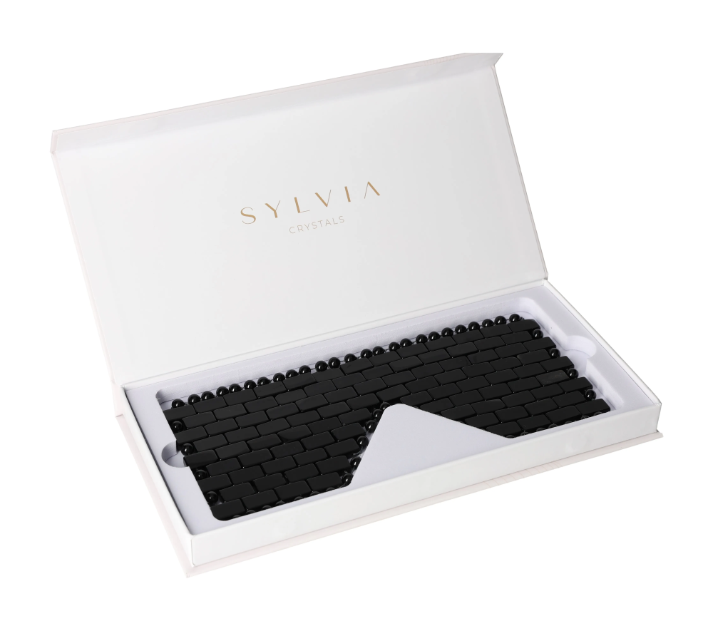 Obsidian Eye Mask 635387 for detoxification, cooling, and reducing puffiness in eyes, presented in a sleek white case.